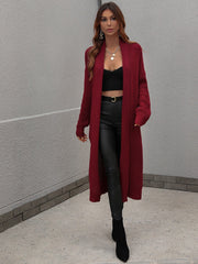 Textured knit maxi cardigan in wine with open front and long sleeves.