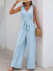 Striped tie-waist wide leg romper in light blue with button detail and v-neck.