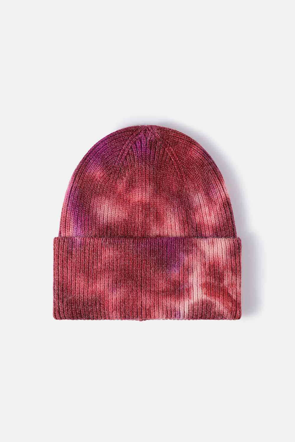 Ribbed knit beanie with a pink and red tie-dye pattern