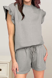 Gray textured lounge set with flutter sleeves and drawstring shorts.