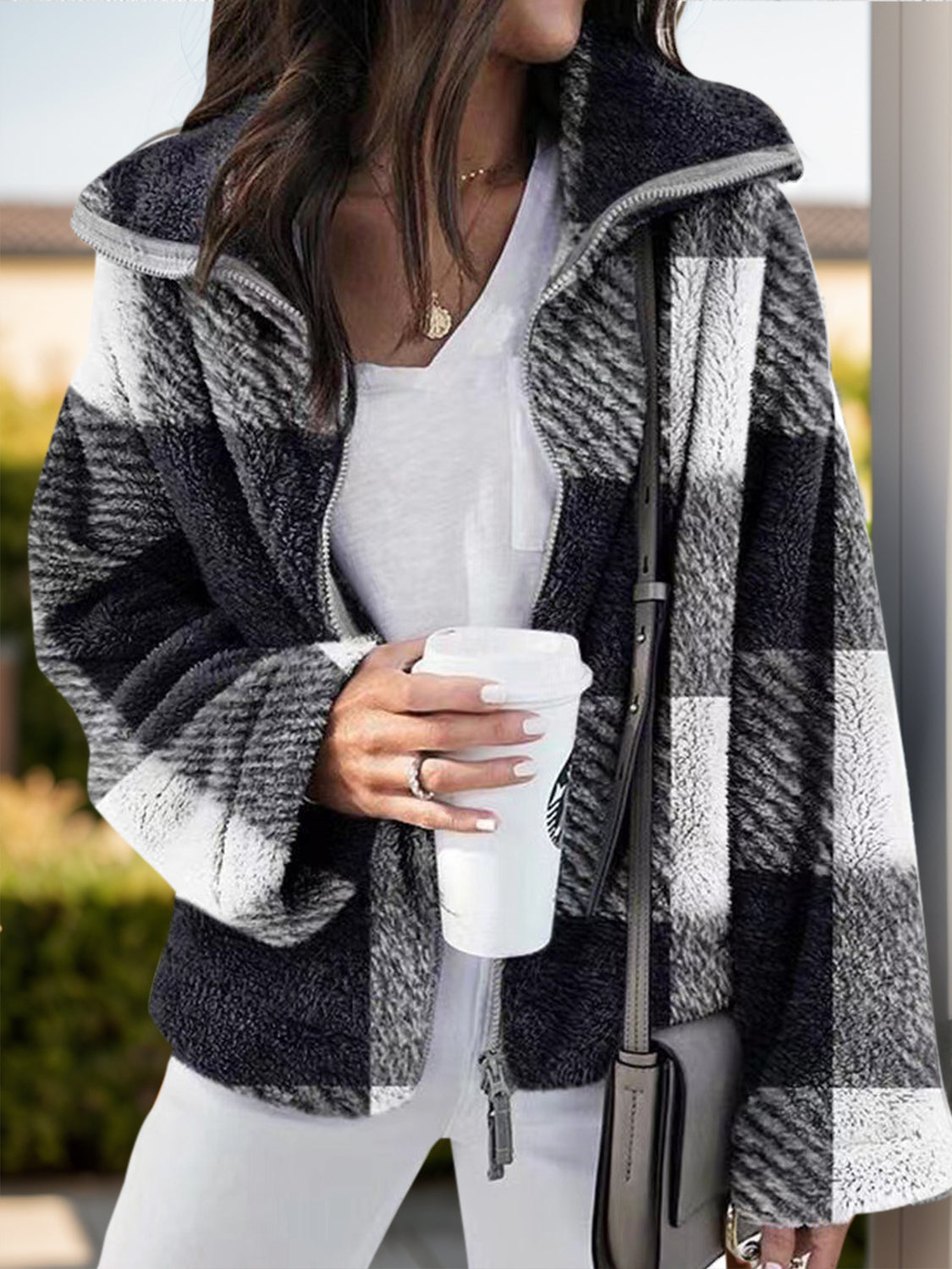 Fluffy plaid zip-up shacket with a stand collar in black and white.