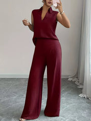Burgundy sleeveless collared top and wide-leg pants set with textured fabric.