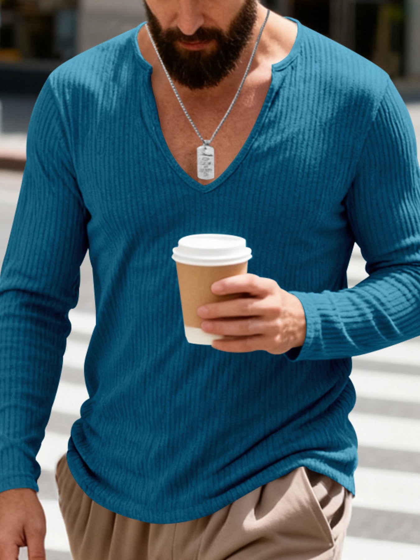 Men's Royal Blue ribbed long sleeve t-shirt with a deep V-neck, worn casually.