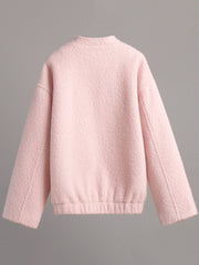 Textured blush pink bouclé bomber jacket with rounded neck and elasticated hem.