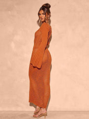 Terracotta open knit maxi dress with bell sleeves and a crochet pattern.