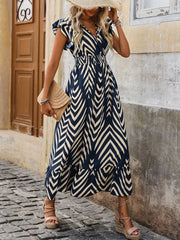 Dark blue and cream geometric print midi dress with ruffled sleeves and hem