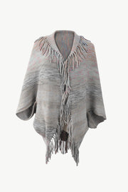 Textured stripe fringe cape in gray with subtle pink and blush accents, acrylic knit.