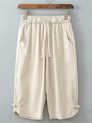 Khaki drawstring cropped sweatpants with tie details at the hem.