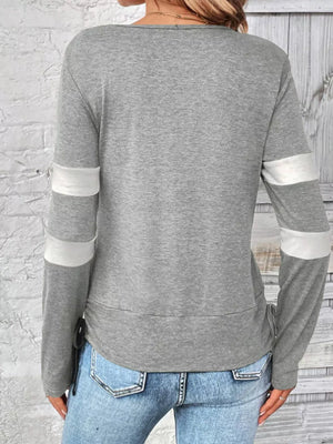 Light gray maternity tee with white sleeve stripes and adjustable side ties.