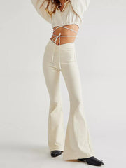Cream flare denim jeans with a v-cut waist and tie detail.