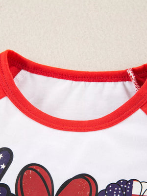 Baby raglan tee with patriotic graphic and red trim.