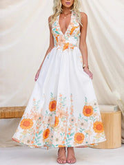 White floral halter neck maxi dress with plunging neckline and gathered waist.