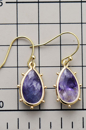Amethyst teardrop earrings with gold detailing and beaded trim.