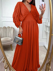Orange-red ruched sleeve V-neck maxi dress with a cinched waist and flowing skirt.