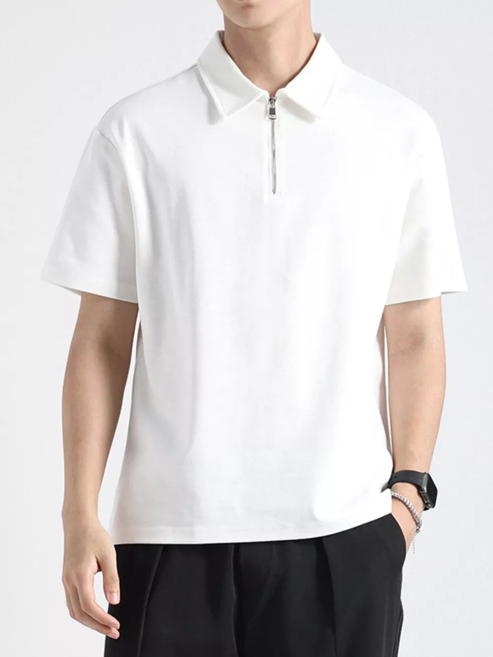 White cotton zippered polo shirt for men with short sleeves and a spread collar.