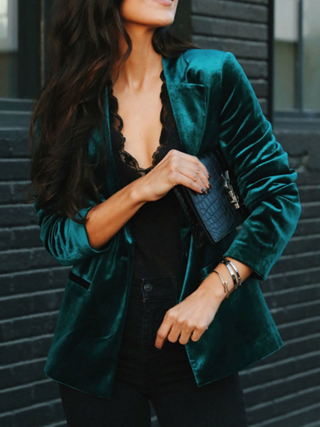 Emerald velvet blazer with black lapels and button front, styled with black lace top.