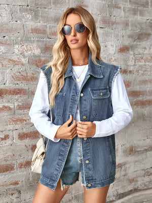 Raw-edge denim utility vest in dusty blue with button front and chest pockets.