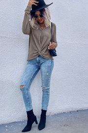 Knot-front waffle knit top in coffee brown with V-neck and long sleeves.