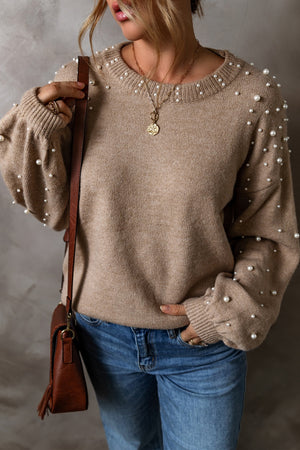 Mocha knit sweater with pearl embellishments on neckline and sleeves.