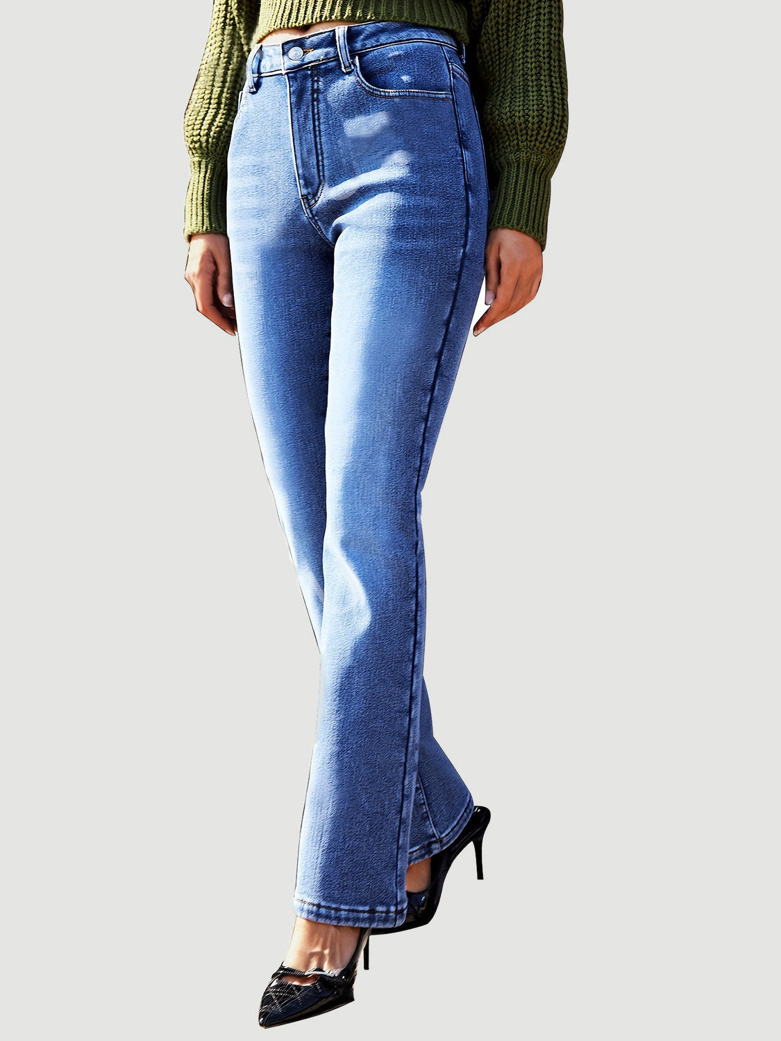Medium wash denim jeans with a subtle flare and bootcut silhouette.