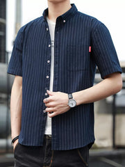 Navy blue striped short sleeve button-up shirt with a chest pocket and white undershirt.