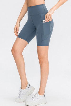 Sculpting pocketed cycling shorts in light blue with a phone pocket detail.