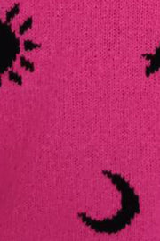 Hot pink acrylic knit sweater with black sun and moon motifs.