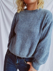 Light blue ribbed knit crewneck sweater with a relaxed fit.
