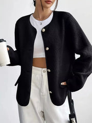 Black textured button-up fleece jacket with round neckline and gold-tone buttons.