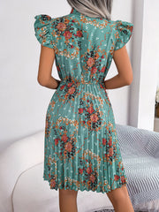 Turquoise floral mini dress with ruffle sleeves and pleated skirt.