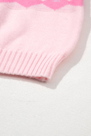 Pink acrylic knit sweater with diamond pattern and ribbed hem detail.