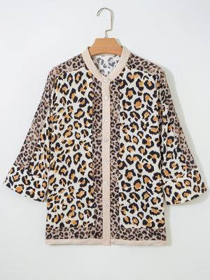 Print button-down shirt with leopard pattern, beige trim, and 3/4 sleeves.
