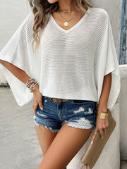 White open-knit dolman sleeve v-neck sweater with a relaxed fit.