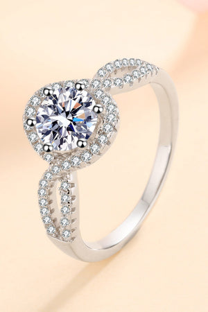 Silver moissanite engagement ring with halo and pave band detail