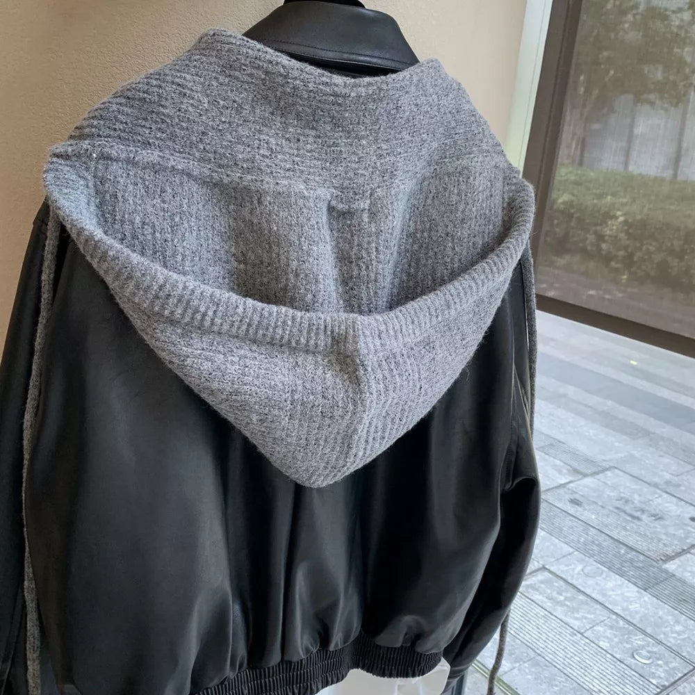 Gray knit hooded scarf with black faux leather jacket detail