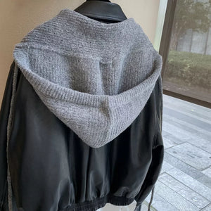 Gray knit hooded scarf with black faux leather jacket detail