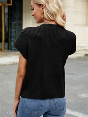 Black knit cap-sleeve top with ribbed texture and a subtle pocket detail.