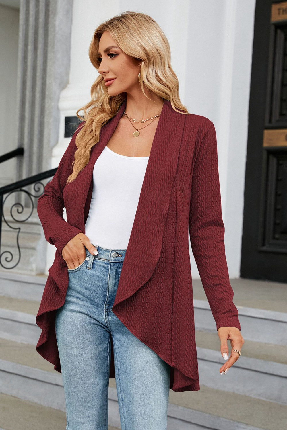 Wine drape-front cable knit cardigan with waterfall neckline.