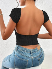 Black ribbed knit open back top with short sleeves and a cropped fit.