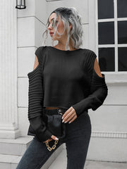 Black ribbed knit cold shoulder sweater with long sleeves.