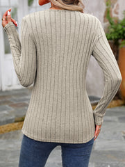 Ribbed knit long sleeve top in Khaki with a round neck and button detail.