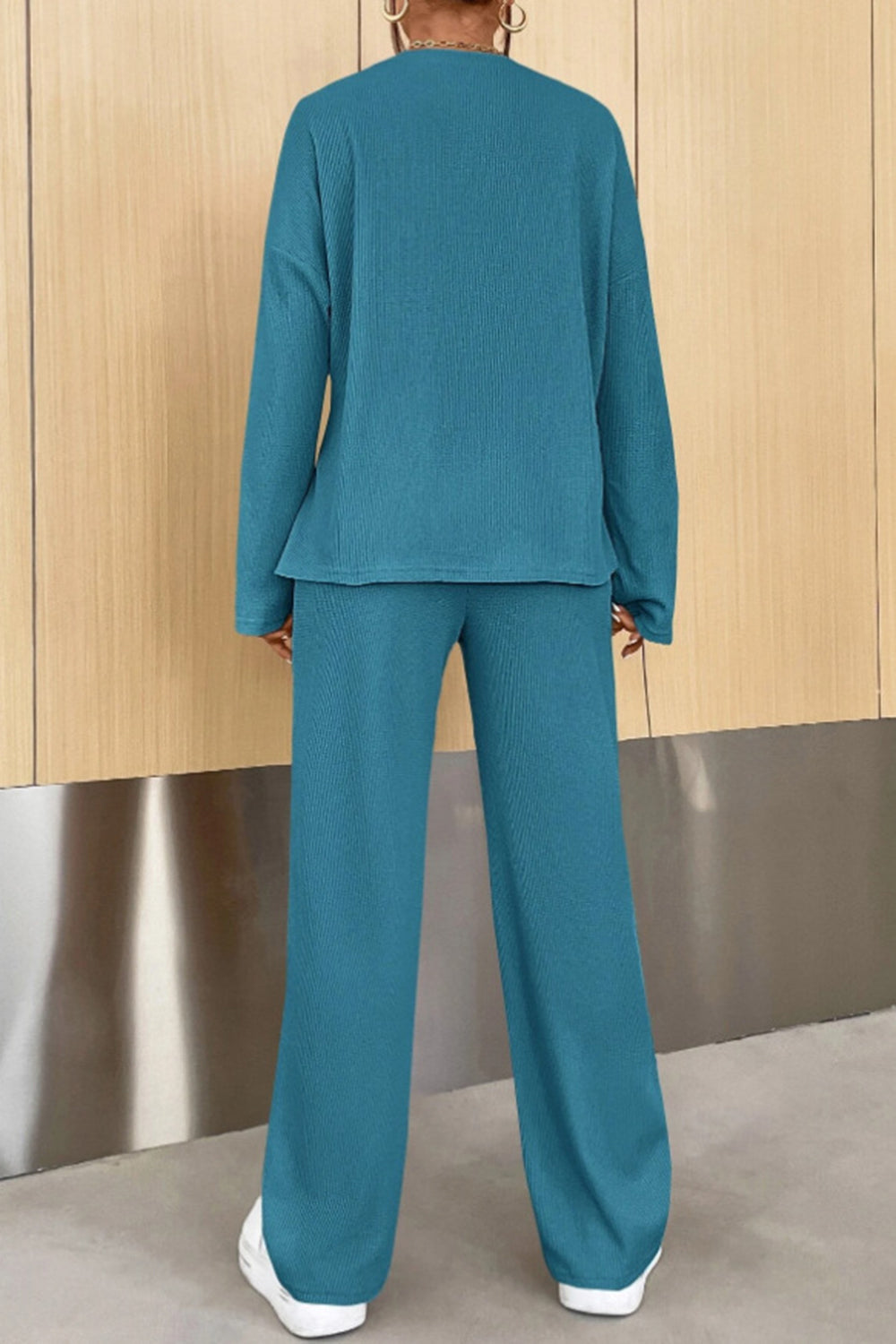 Teal ribbed henley set with long sleeves and wide-leg pants.