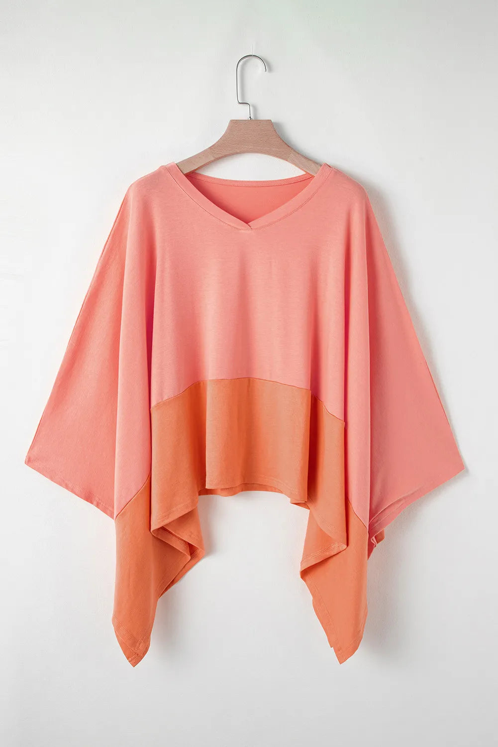 Colorblock drape batwing blouse in sherbet with V-neck and asymmetrical hem
