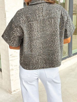 Denim leopard print short-sleeve shirt with a collared neckline.
