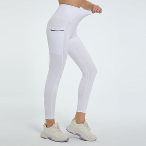 White pocketed sculpt leggings with a zippered pocket detail.