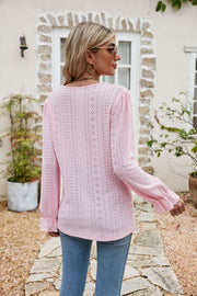 Blush pink eyelet lace blouse with ruffle sleeves and cuffs.