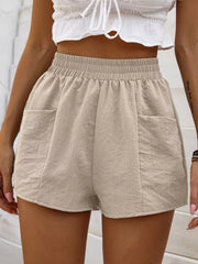 Beige linen blend shorts with elastic waist and two front pockets.