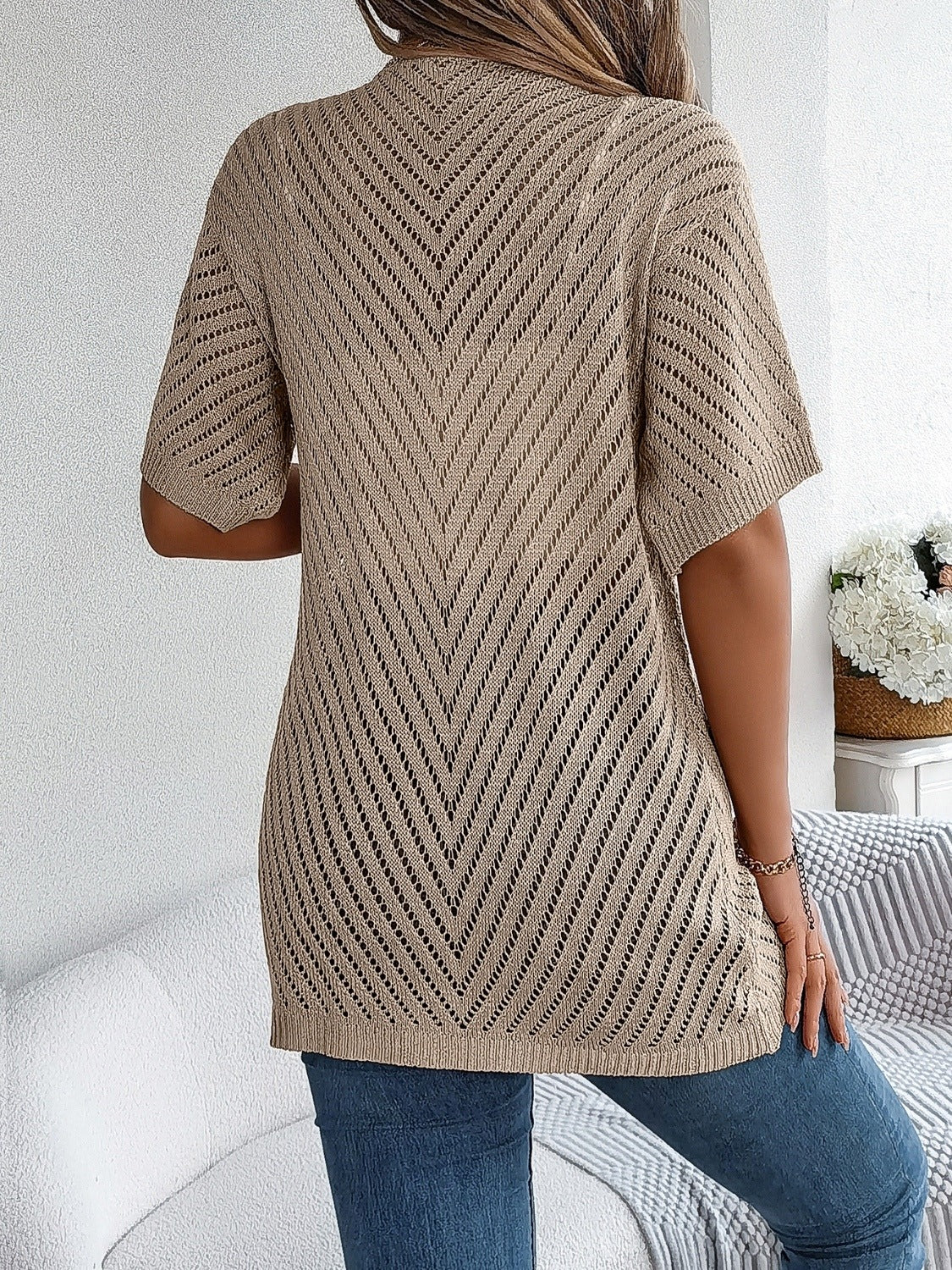 Khaki open-knit slouchy cardigan with short sleeves and chevron pattern.