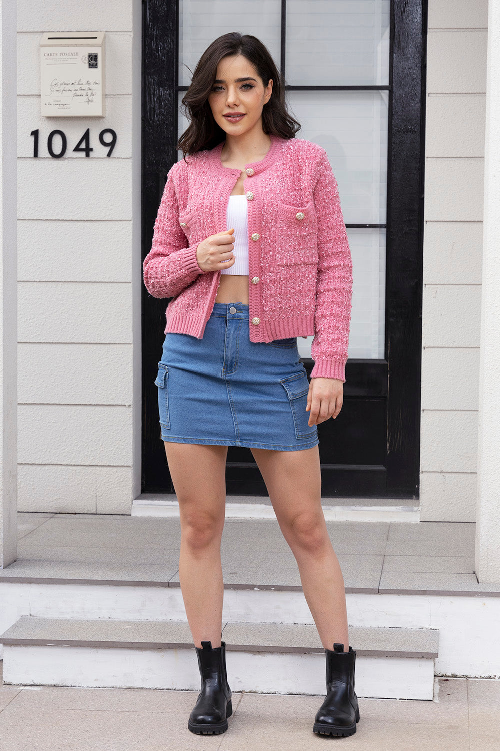 Hot pink bouclé knit bolero jacket with gold buttons and pocket details.