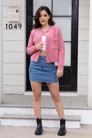 Hot pink bouclé knit bolero jacket with gold buttons and pocket details.
